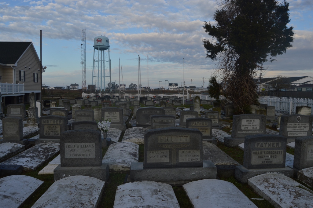 Frequent flooding requires coverings over graves on Tangier Island. Photo by Tom Pelton