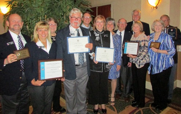 Kent Narrows Sail & Power Squadron and Annapolis Sail & Power Squadron displaying their awards: (Left to Right) ASPS CDR John Nash, ASPS P/C Kathy Nash, ASPS SEO Mike Maszczenski, Jr. and his wife Georgiana, Terry Sattery, Peggy  Slattery, KNSPS P/C Sari Lafferty, KNSPS SEO John Locke, P/D/C Martin Lafferty, KNSPS Treasurer Barbara Locke, KNSPS CDR Kathy Burke, Asst. Ed. Officer Joseph Burke. 