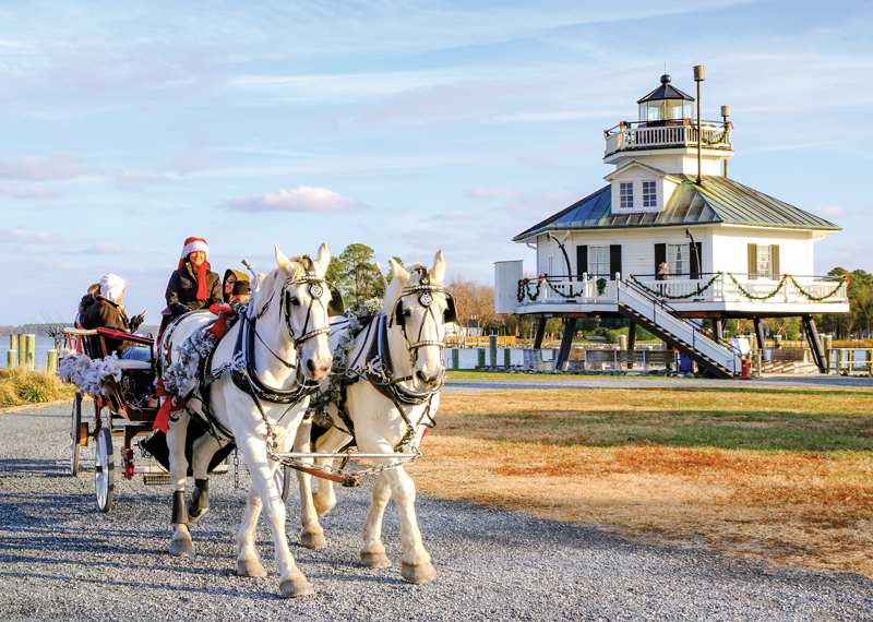 Chesapeake Bay Maritime Museum horses pulling wagon with lighthouse in background