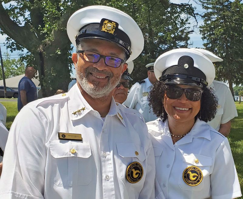 A man and a woman in Sea Scout leader uniforms