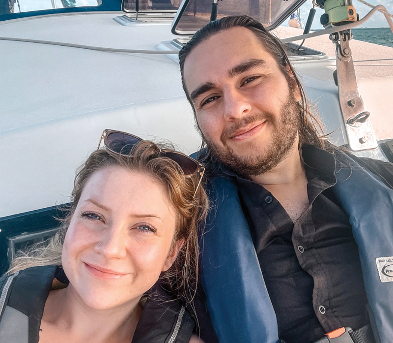 sailors smiling aboard sailboat