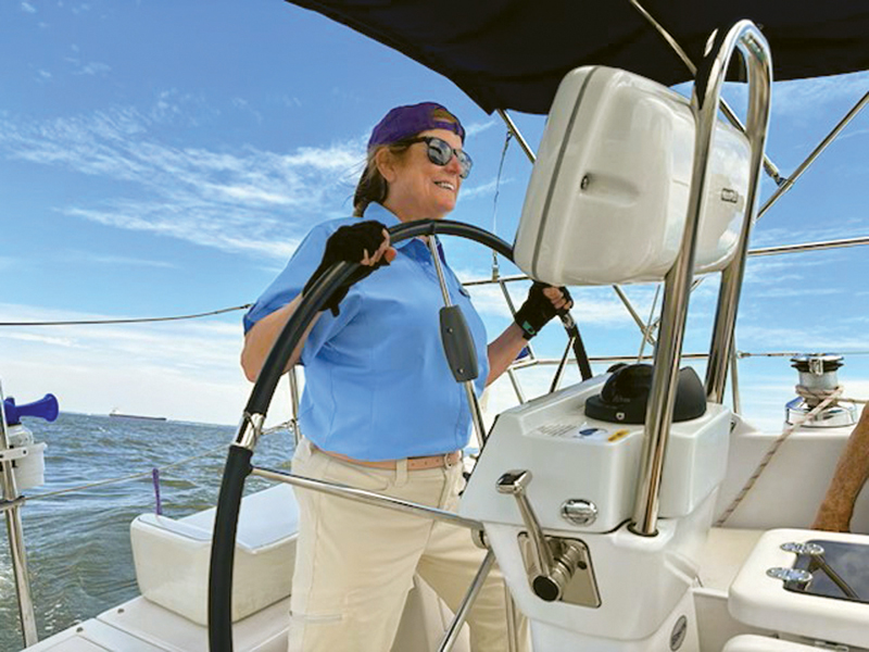 Steering at the helm of a sailboat