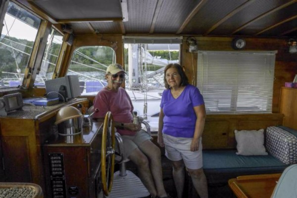 Al Ponessa and Dot Govan on Dot’s boat, Long Reach. Photo by Bob Bedell.