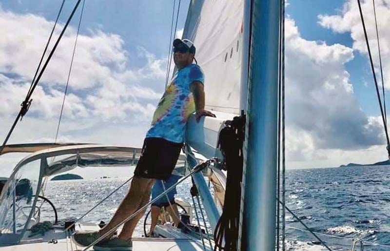 man on deck of charter sailboat