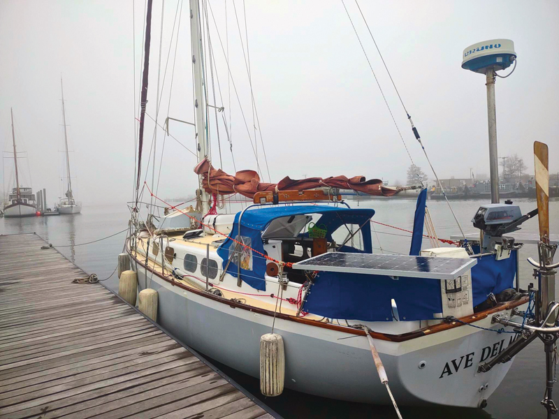 sailboat docked at a pier